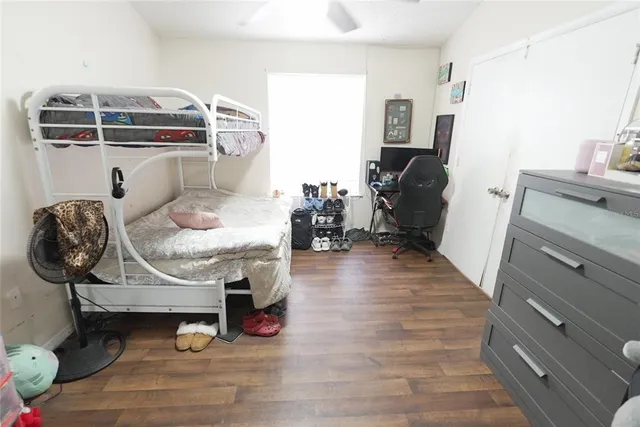 a living room with furniture and a mirror