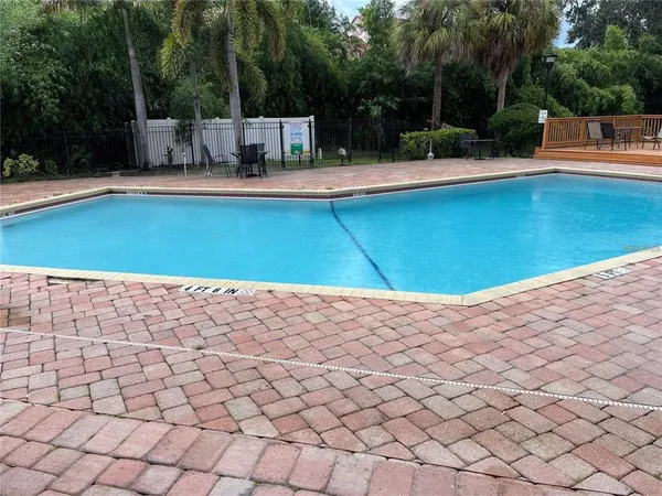 a view of swimming pool with a patio