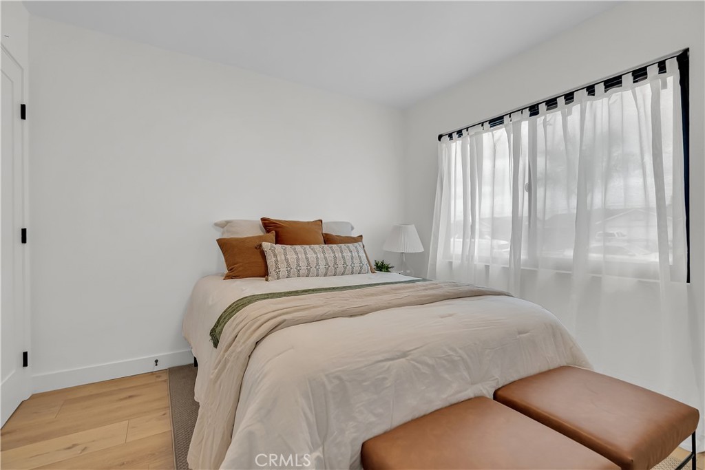 16766 Sam Gerry Drive La Puente, CA 91744 - Photo 19 of 31 a bedroom with a bed and a chair