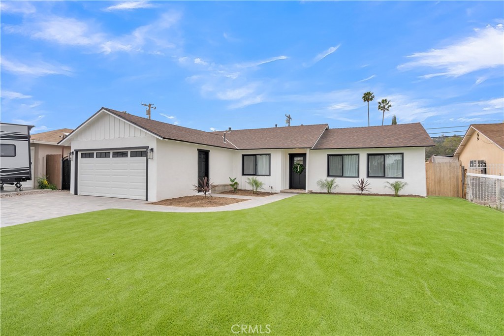 16766 Sam Gerry Drive La Puente, CA 91744 - Photo 2 of 31 a front view of a house with a garden and porch
