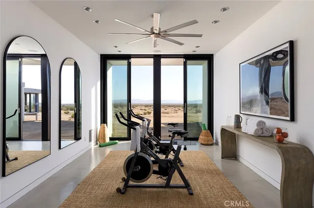 a room with gym equipment and a large window