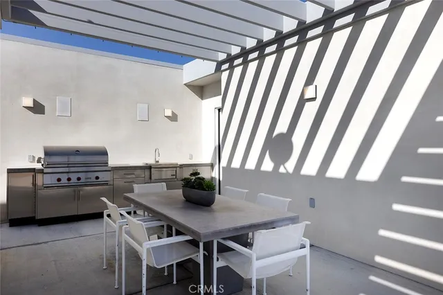 a view of a dining room with furniture and a window