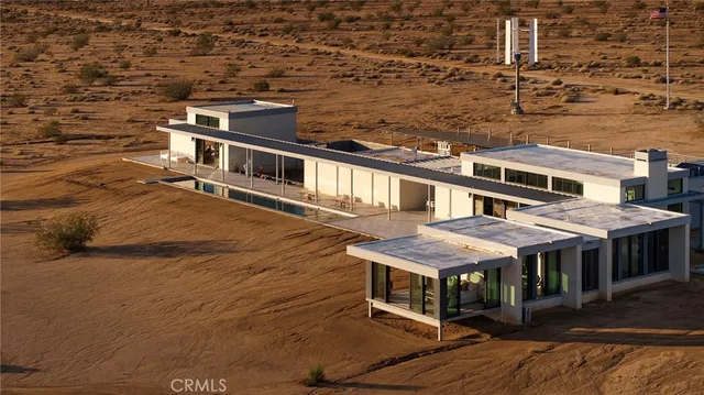 a aerial view of a house with a ocean view