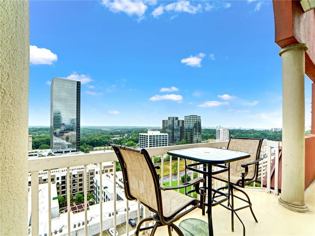 3435 Kingsboro Road Northeast, Unit 1601 Atlanta, GA 30326 - Photo 37 of 54 a balcony with table and chairs