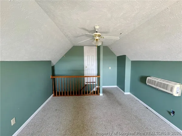 a view of a storage & utility room with stairs