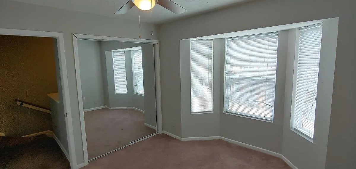 4441 Old College Road, Unit 5204 Bryan, TX 77801 - Photo 11 of 14 an empty room that has a window