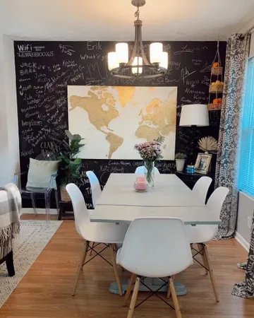a living room with furniture a rug and a chandelier