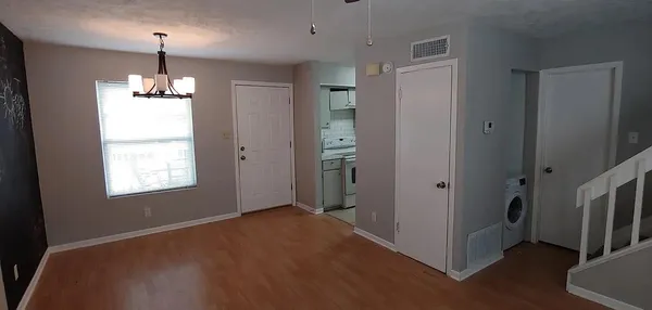 a view of livingroom with hardwood floor and window