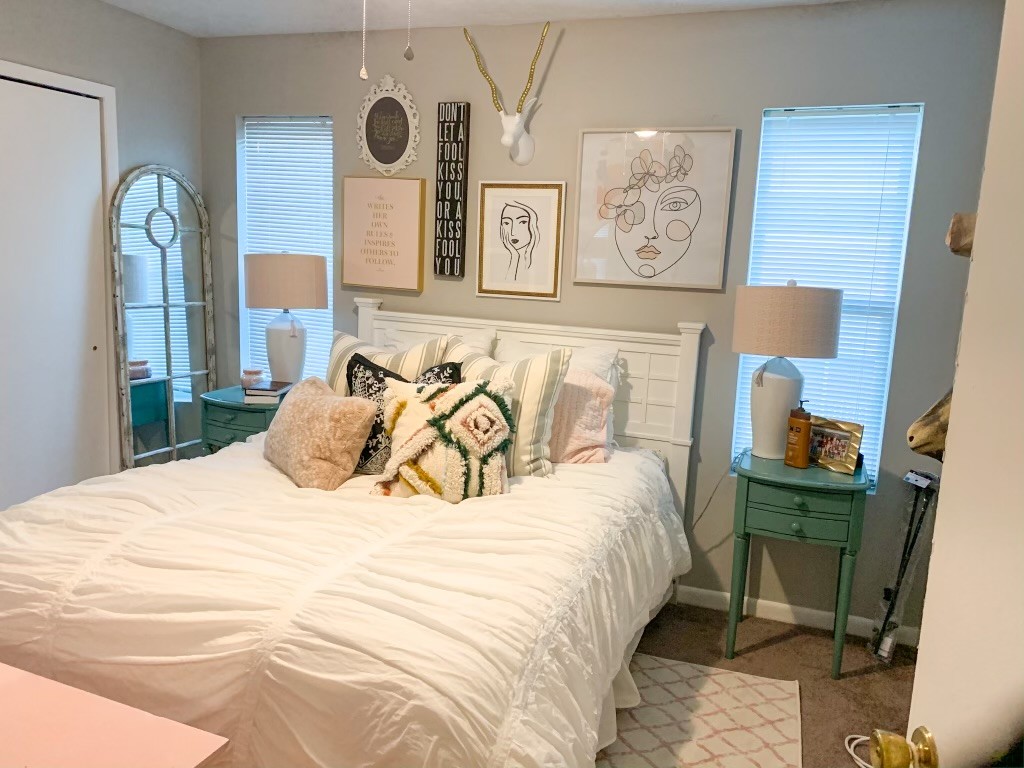 4441 Old College Road, Unit 5204 Bryan, TX 77801 - Photo 8 of 14 a bedroom with a bed a clock on the wall and dresser