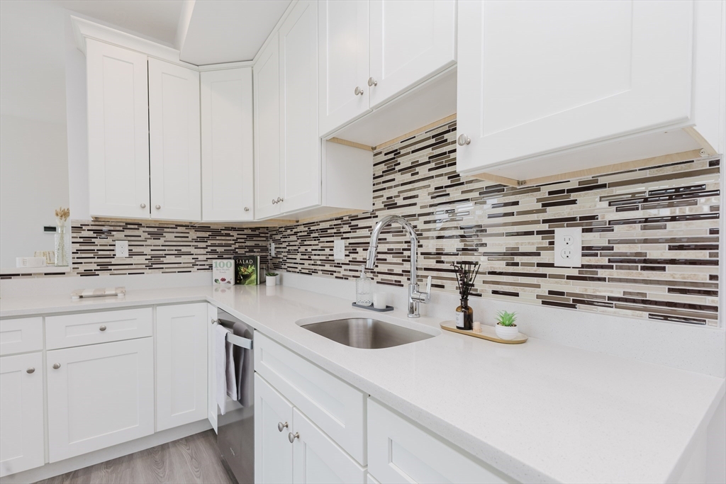 92-94 George Street, Unit 202 Boston, MA 02119 - Photo 15 of 42 a kitchen with a sink and cabinets