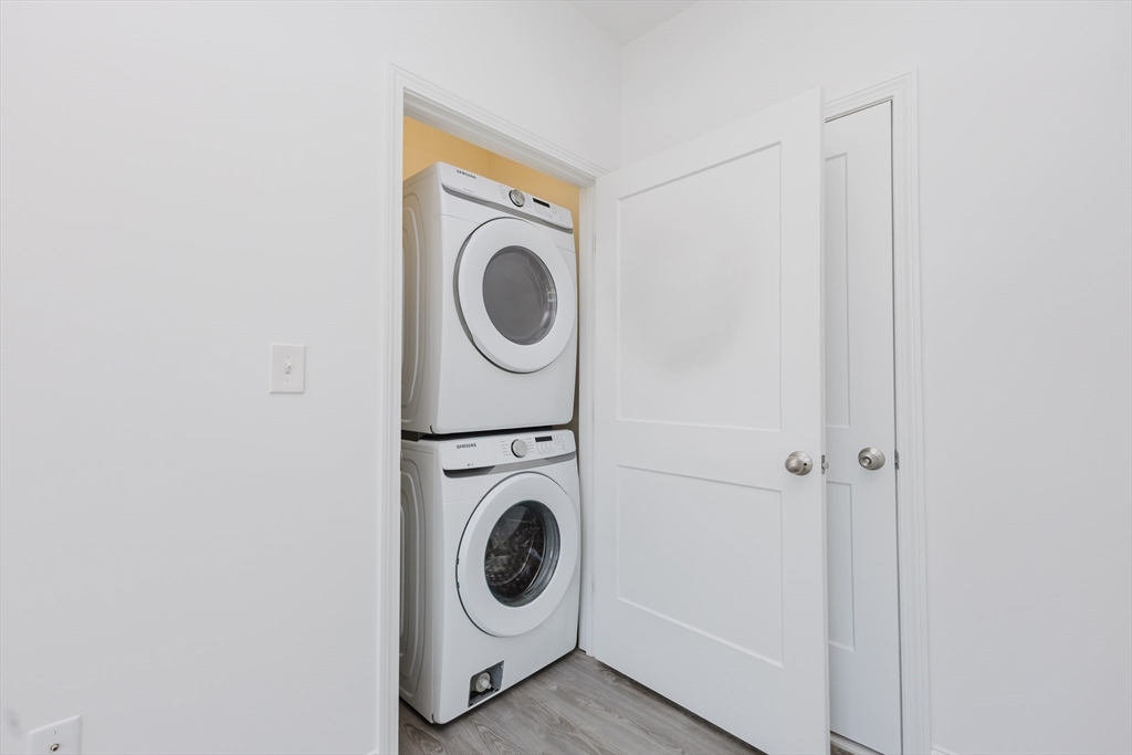 92-94 George Street, Unit 202 Boston, MA 02119 - Photo 18 of 42 a utility room with dryer and washer