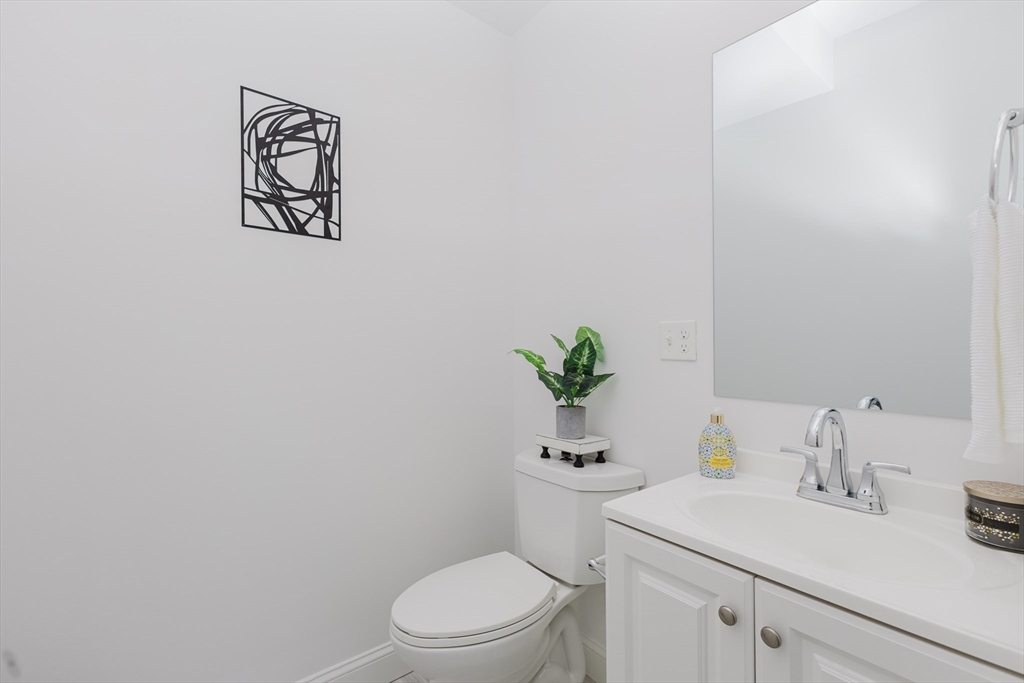 92-94 George Street, Unit 202 Boston, MA 02119 - Photo 19 of 42 a white toilet sitting next to a bathroom sink