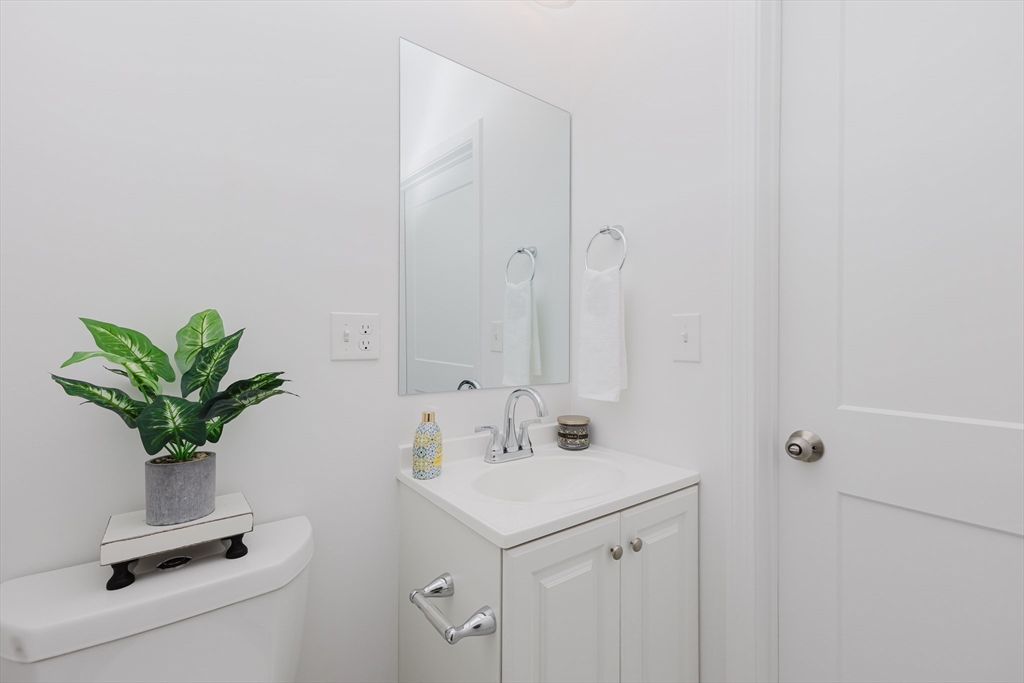 92-94 George Street, Unit 202 Boston, MA 02119 - Photo 20 of 42 a bathroom with a sink a mirror and shower