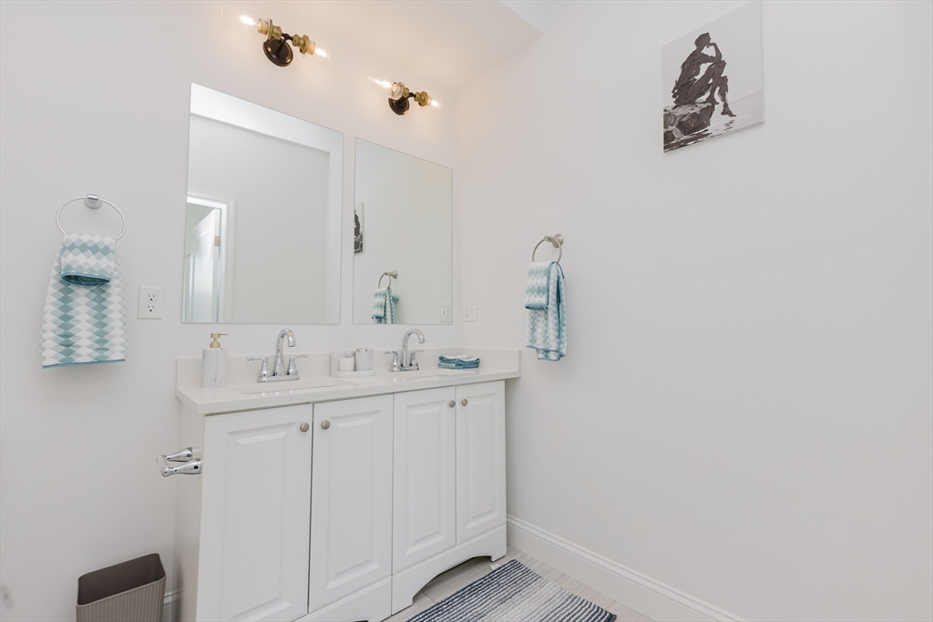 92-94 George Street, Unit 202 Boston, MA 02119 - Photo 26 of 42 a bathroom with a sink and a mirror