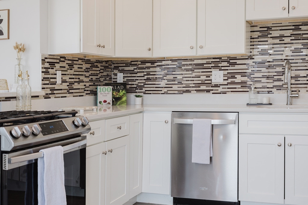 92-94 George Street, Unit 202 Boston, MA 02119 - Photo 30 of 42 a kitchen with cabinets and appliances