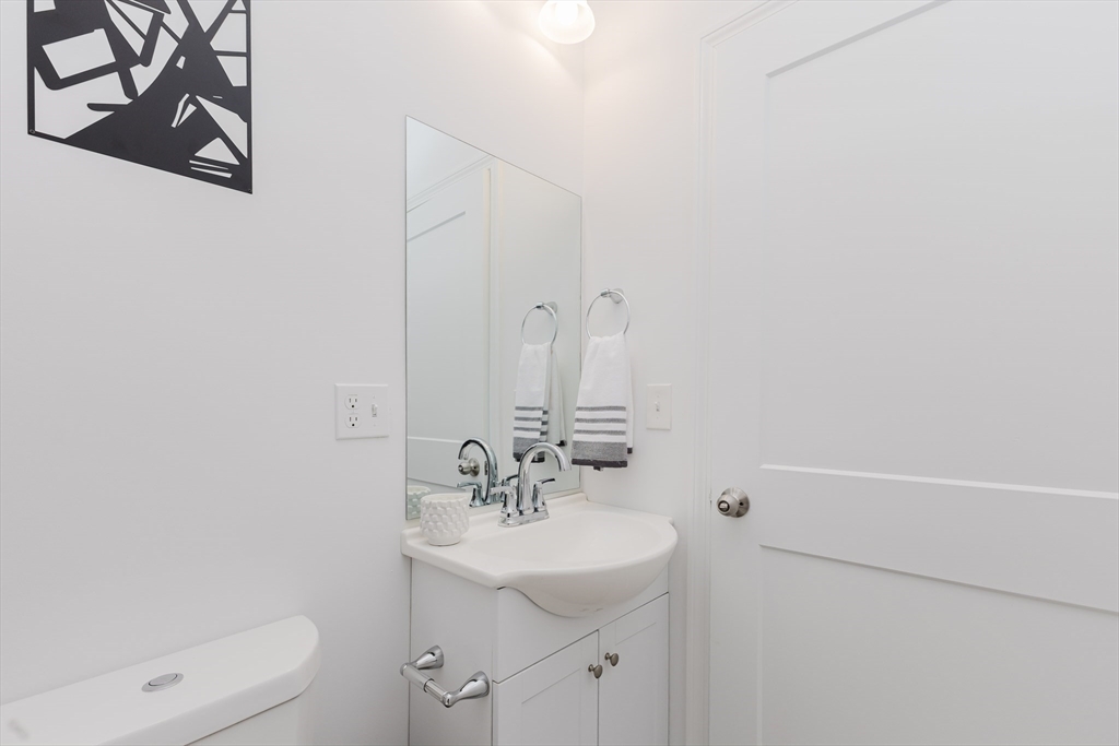 92-94 George Street, Unit 202 Boston, MA 02119 - Photo 36 of 42 a bathroom with a sink a toilet and shower