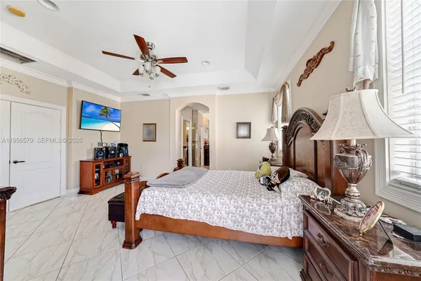 a view of a balcony with furniture and floor to ceiling window