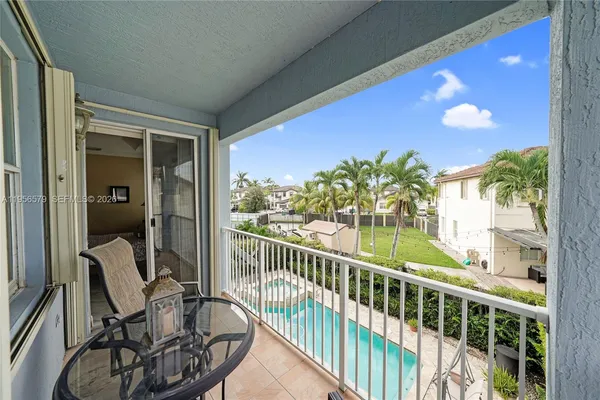 a living room with furniture a rug and a shower
