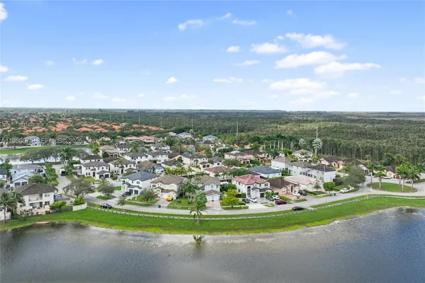 an aerial view of a house with outdoor space