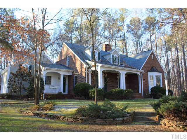 This beauty is perched on a heavily landscaped knoll on a very private 1.76 acre home-site. The winding drive leads to a side-entry garage and extra parking area. Don't miss the extensive stonework and the Friend's Entry!