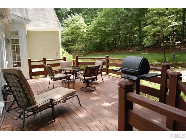 2440 High Ridge Drive Raleigh, NC 27606 - Photo 11 of 13 Springtime is always a favorite time for grilling out on your over-sized deck. Rear of house is finished with fiber cement siding. Natural gas grill conveys.
