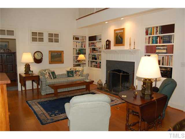 WOW! Nostalgic and heartwarming vaulted family room with masonry stone fireplace. Doorway and 2x2 windows open to home office. Southern yellow pine flooring accents the decor.
