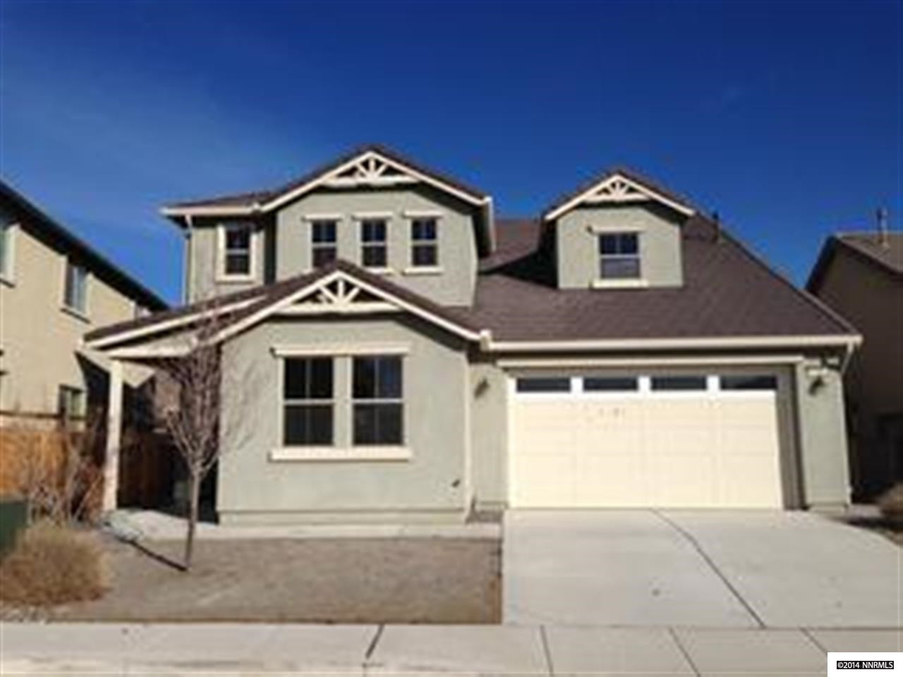 7345 Windswept Loop Sparks, NV 89436 - Photo 1 of 1 a front view of a house with yard