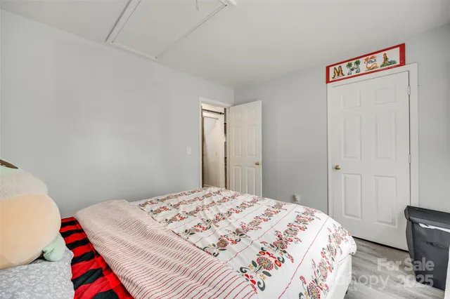 a bedroom with a bed and a closet