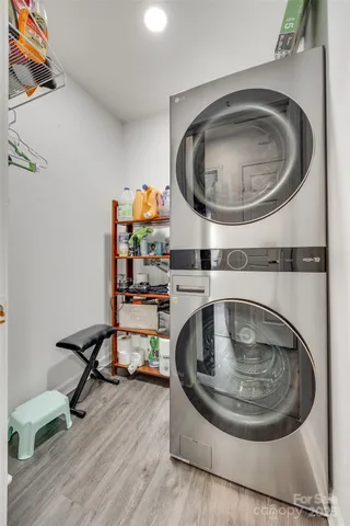 a close view of light fixtures and a sink with washer and dryer