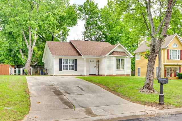 a house with trees in the background