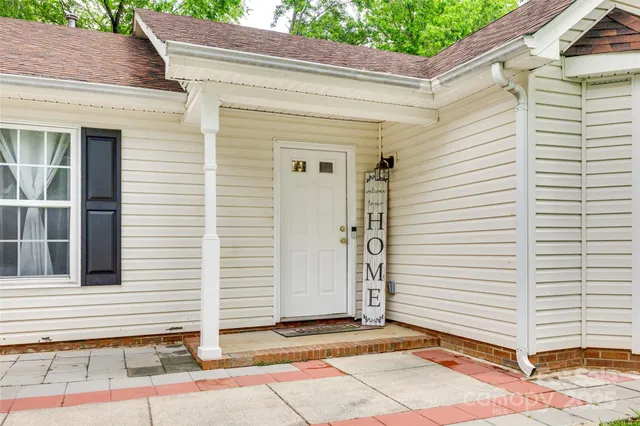 a view of a house with a door and a window