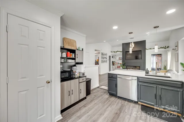 a kitchen with stainless steel appliances granite countertop a stove and cabinets