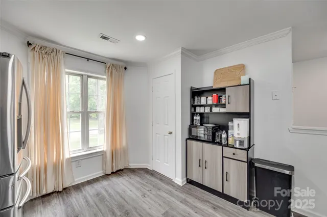 a view of kitchen and wooden floor