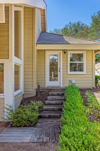 a front view of a house with a yard