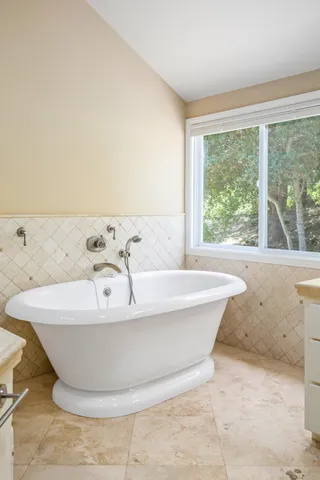 a white bath tub sitting in a bathroom
