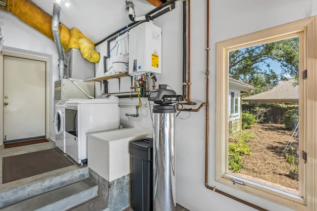 a view of living room with furniture and a window