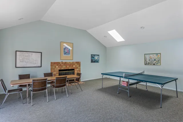 a view of a workspace with furniture