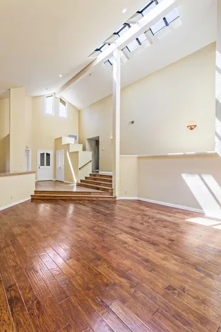 a view of a kitchen with wooden floor