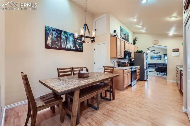 a view of kitchen with cabinets and wooden floor