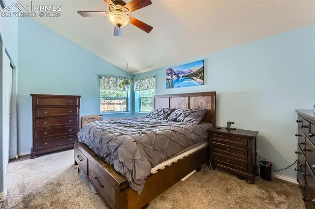 a bedroom with a bed dresser and a window