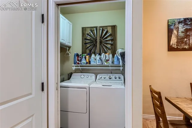 a utility room with dryer washer and dryer