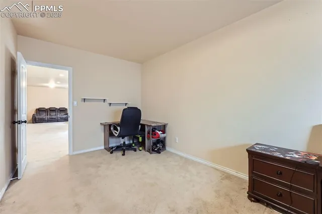 a view of a workspace with furniture