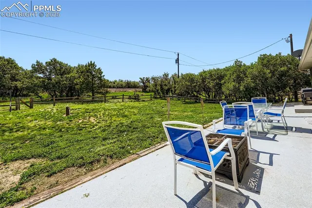 a view of a chairs and table in the patio