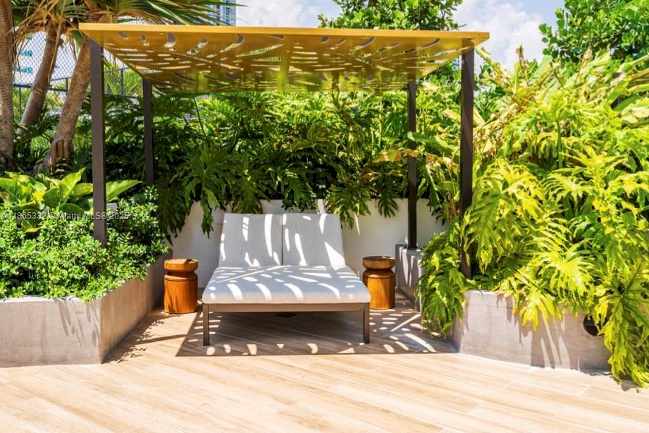 700 Northeast 24th Street, Unit 4303 Miami, FL 33137 - Photo 30 of 41 a view of a garden with pathway