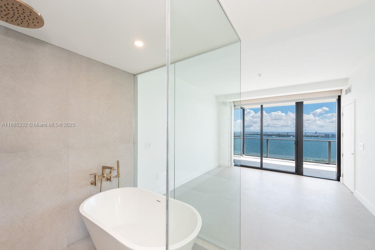 700 Northeast 24th Street, Unit 4303 Miami, FL 33137 - Photo 8 of 41 a bathroom with a sink and mirror