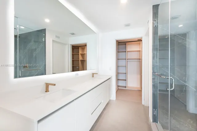 a bathroom with a tub sink and shower
