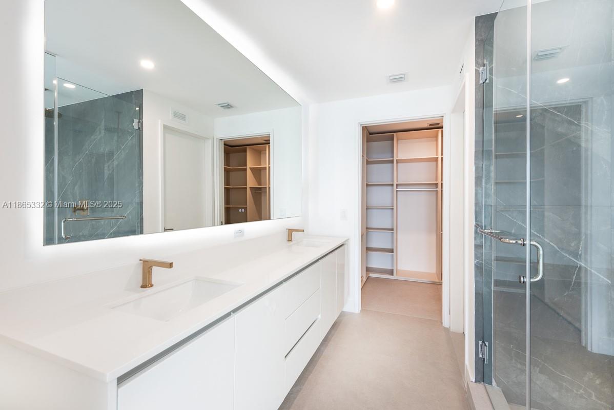 700 Northeast 24th Street, Unit 4303 Miami, FL 33137 - Photo 10 of 41 a bathroom with a tub sink and shower