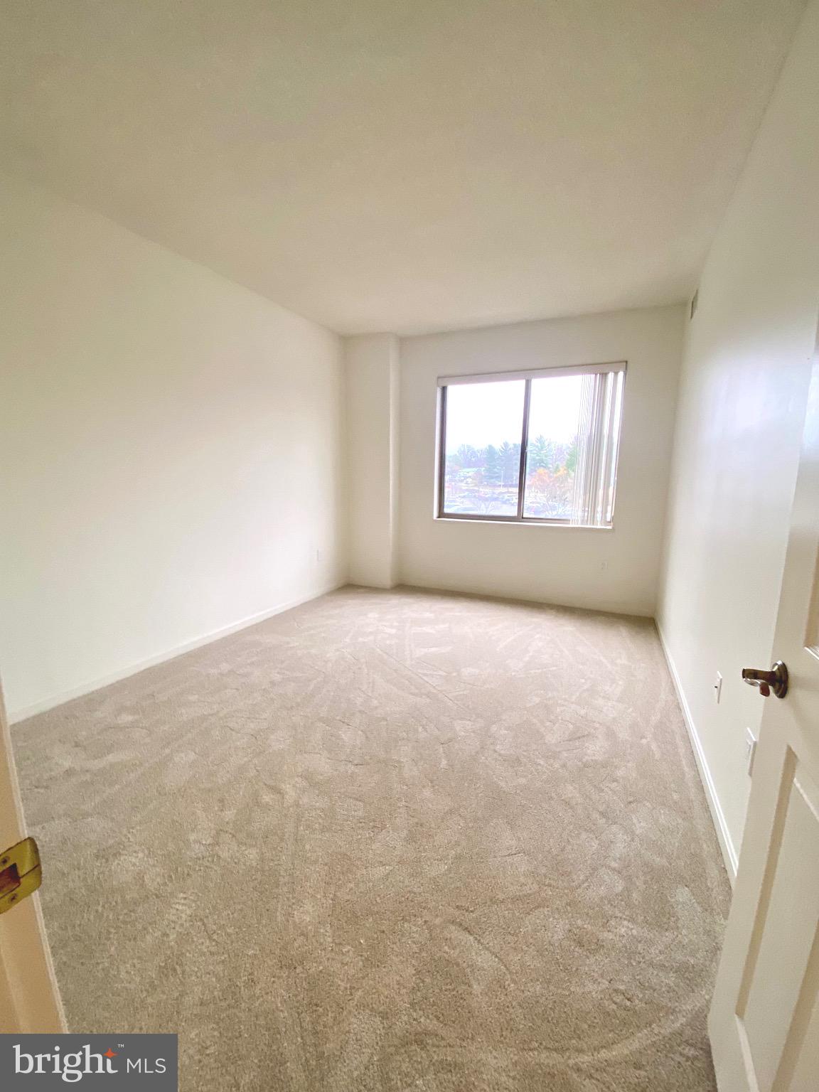 3200 North Leisure World Boulevard, Unit 115 Silver Spring, MD 20906 - Photo 13 of 28 an empty room with windows