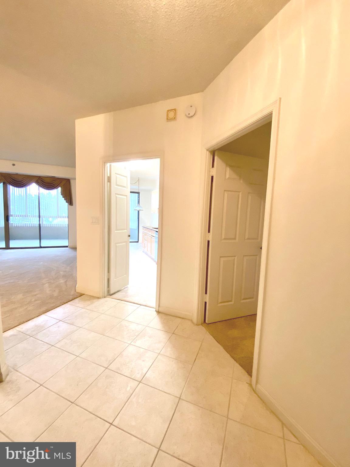 3200 North Leisure World Boulevard, Unit 115 Silver Spring, MD 20906 - Photo 3 of 28 a view of a hallway with wooden floor