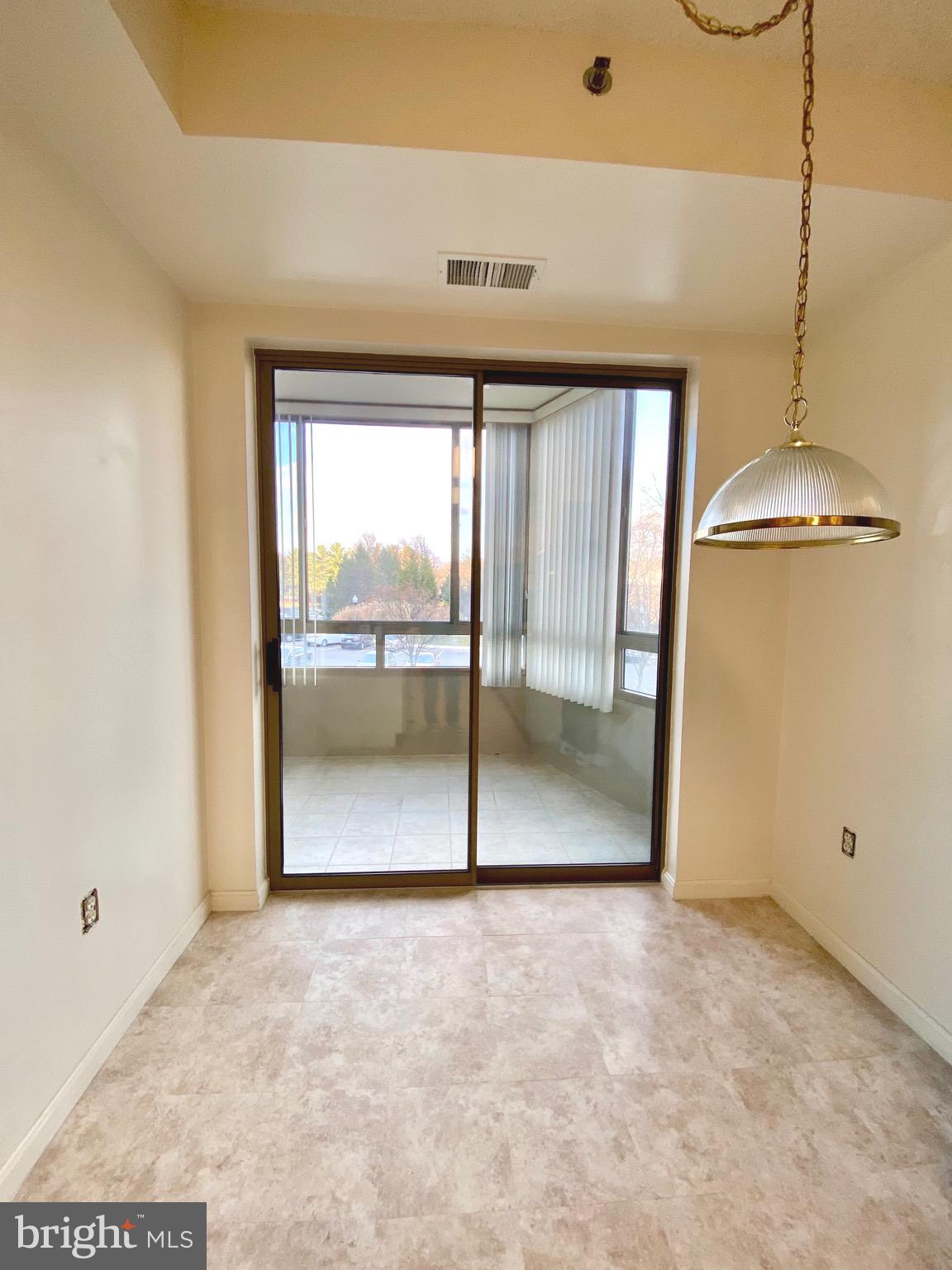 3200 North Leisure World Boulevard, Unit 115 Silver Spring, MD 20906 - Photo 5 of 28 a view of an empty room